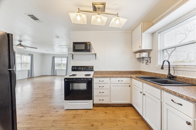 kitchen with black appliances, white cabinetry, light hardwood / wood-style floors, sink, and ceiling fan