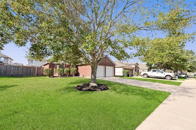 single story home featuring a front yard and a garage