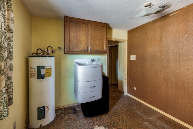 utility room featuring water heater