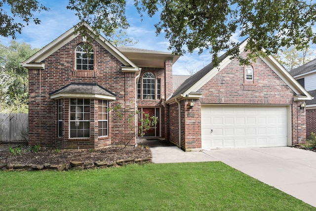 view of property with a front lawn and a garage