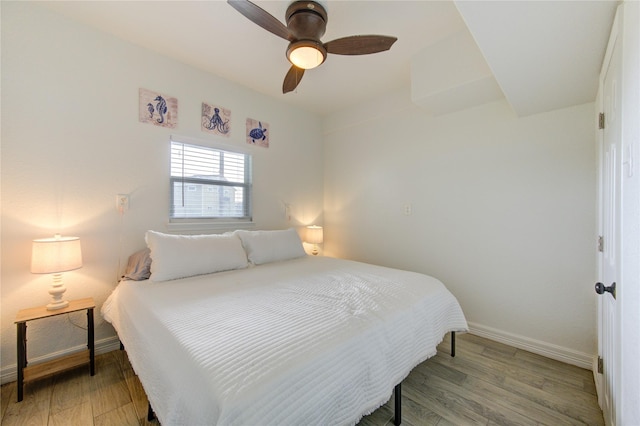 bedroom with light hardwood / wood-style floors and ceiling fan