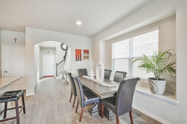 dining space featuring light wood-type flooring