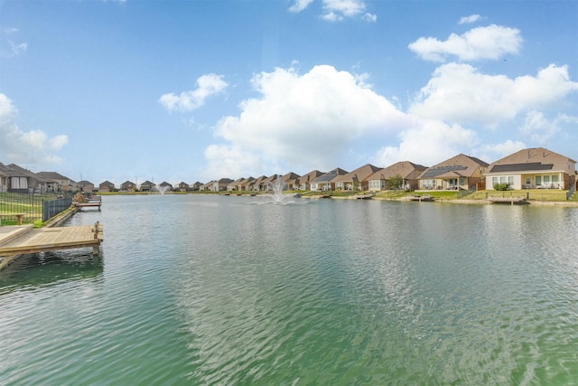 property view of water with a dock