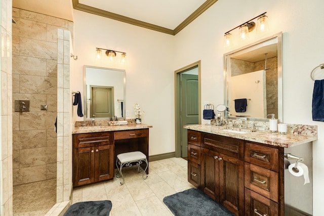 14 Augusta Ln, West Columbia, TX 77486 - bathroom with crown molding, tiled shower, and two vanities