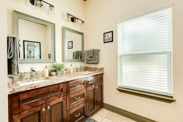 14 Augusta Ln, West Columbia, TX 77486 - bathroom with double vanity, tile patterned floors, and plenty of natural light