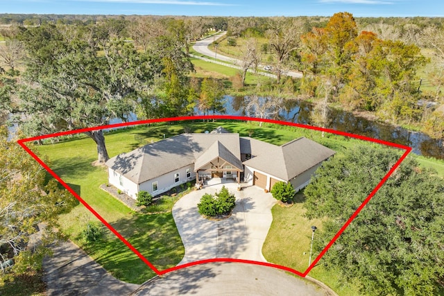 birds eye view of property featuring a water view