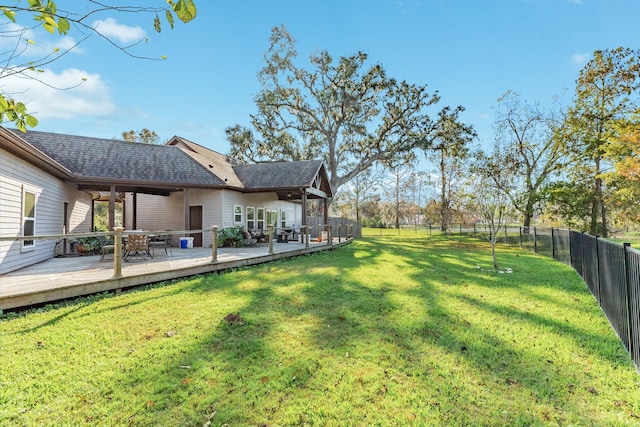 view of yard with a wooden deck