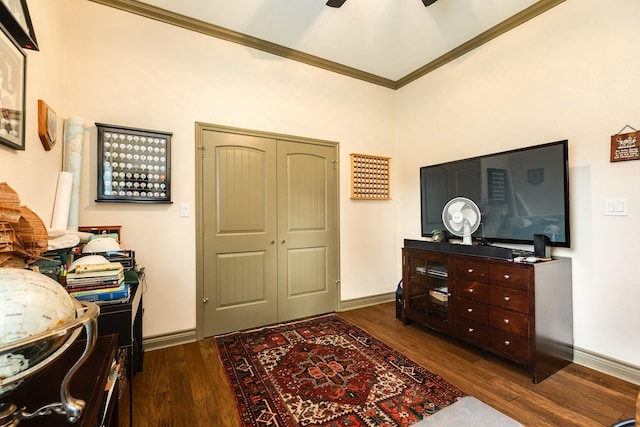 interior space with dark hardwood / wood-style floors, ceiling fan, and crown molding