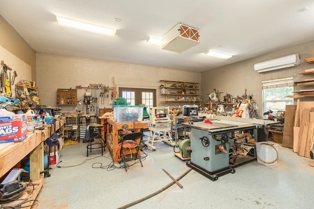 14 Augusta Ln, West Columbia, TX 77486 - garage with a workshop area and a wall mounted air conditioner