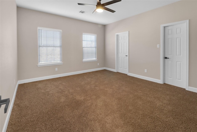 carpeted empty room with ceiling fan