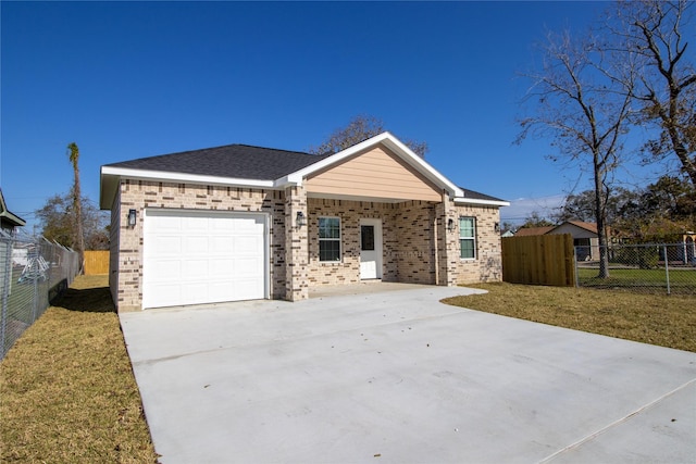 single story home with a garage and a front yard