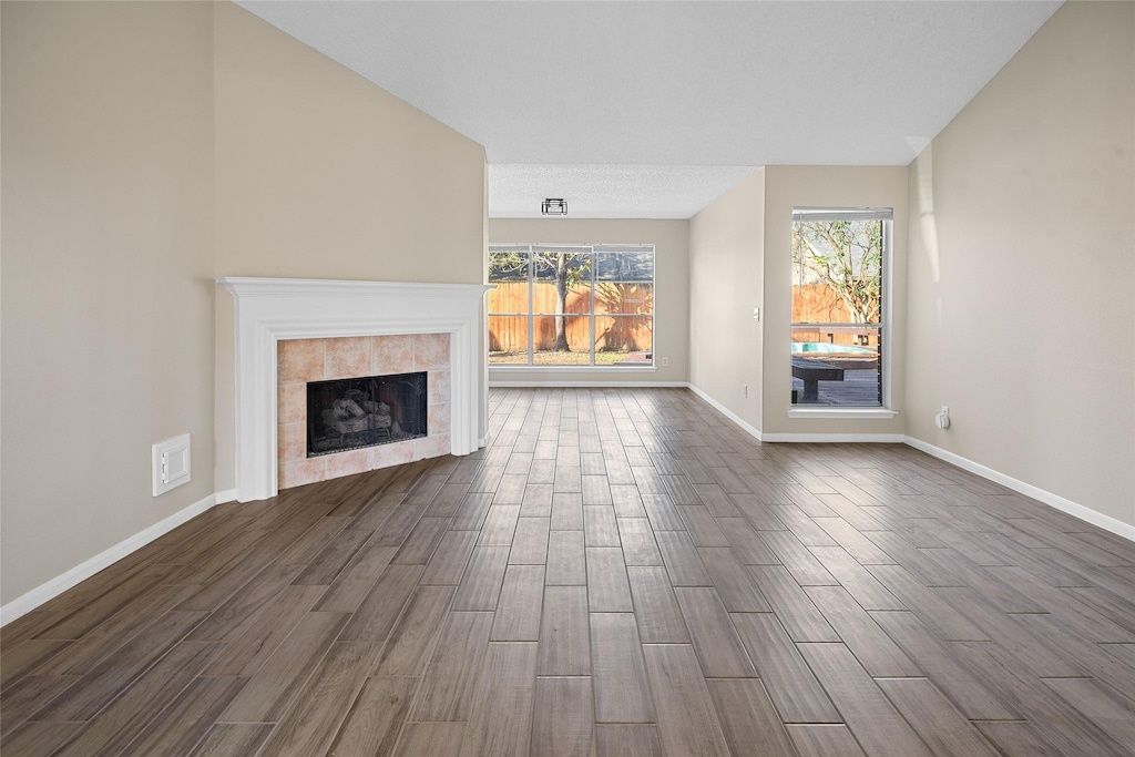 unfurnished living room featuring a fireplace