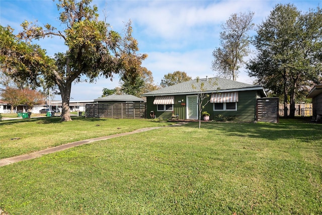 2418 Roy Cir, Houston, TX 77007 - exterior space featuring a lawn, fence, and a shingled roof