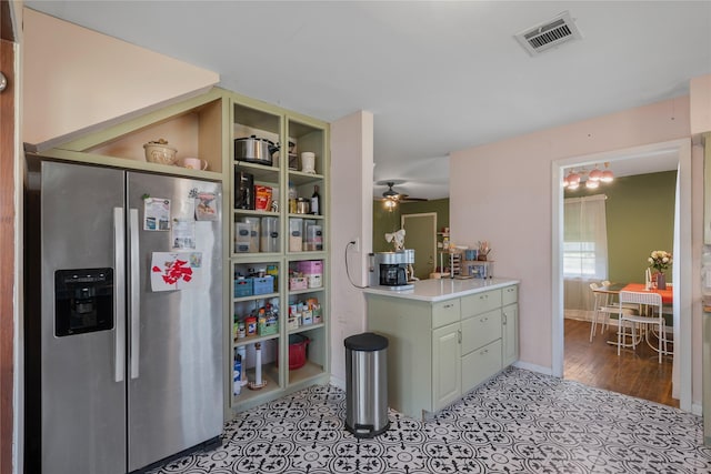 kitchen with ceiling fan, stainless steel fridge, and light hardwood / wood-style floors