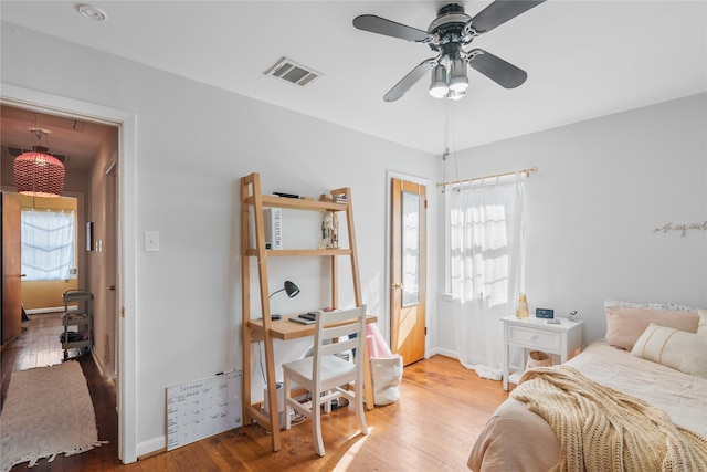 bedroom with ceiling fan and wood-type flooring