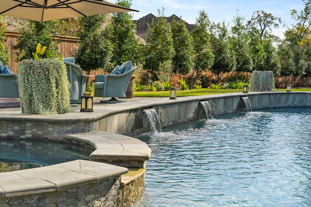 view of swimming pool featuring pool water feature