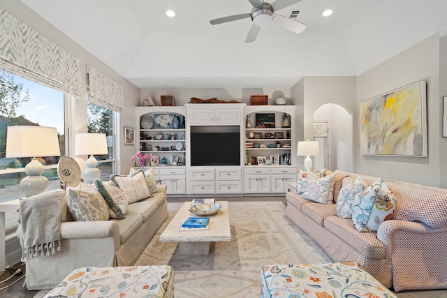 living room featuring high vaulted ceiling and ceiling fan