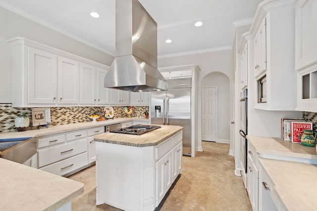 kitchen featuring island range hood, a center island, white cabinets, and appliances with stainless steel finishes