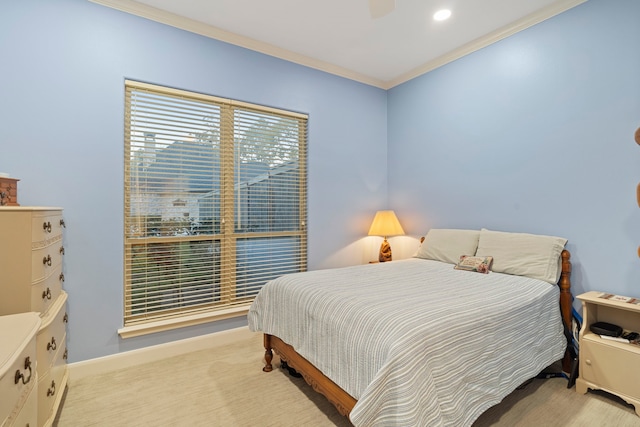 bedroom with light carpet, crown molding, and ceiling fan