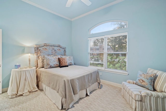 carpeted bedroom with crown molding and ceiling fan