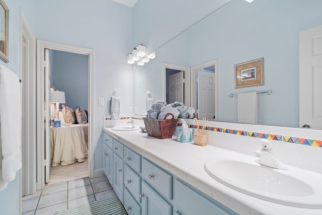 bathroom with vanity and tile patterned flooring