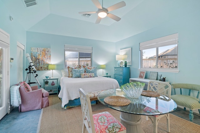 carpeted bedroom with multiple windows and ceiling fan