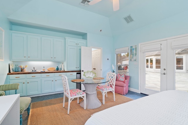 bedroom with vaulted ceiling, french doors, and ceiling fan