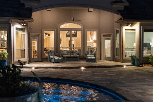 exterior space with pool water feature, ceiling fan, and a patio