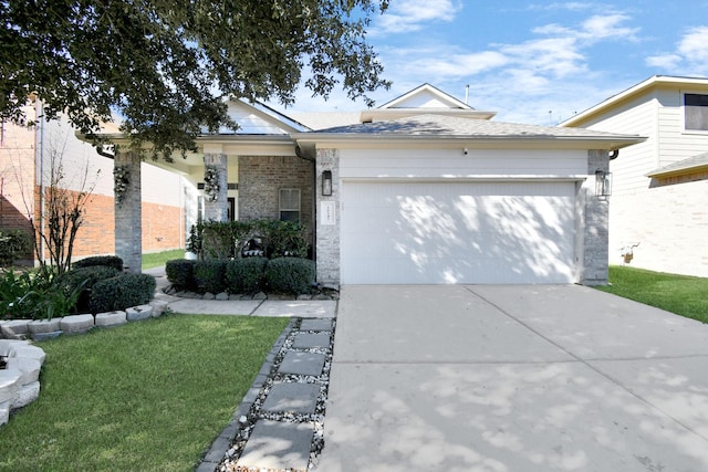 ranch-style house featuring a garage and a front yard