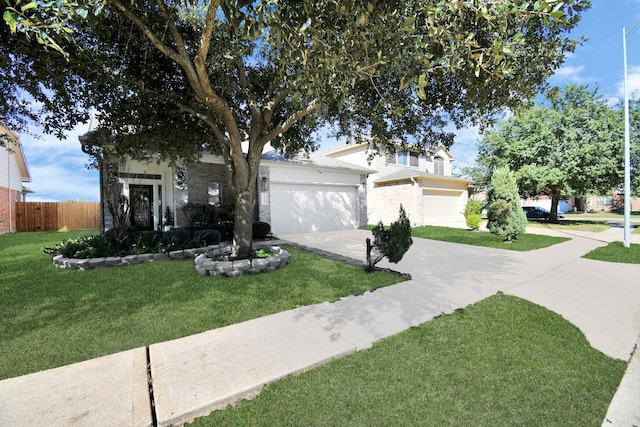 view of front of house featuring a front yard and a garage