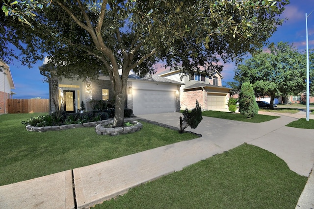 view of front facade featuring a lawn and a garage