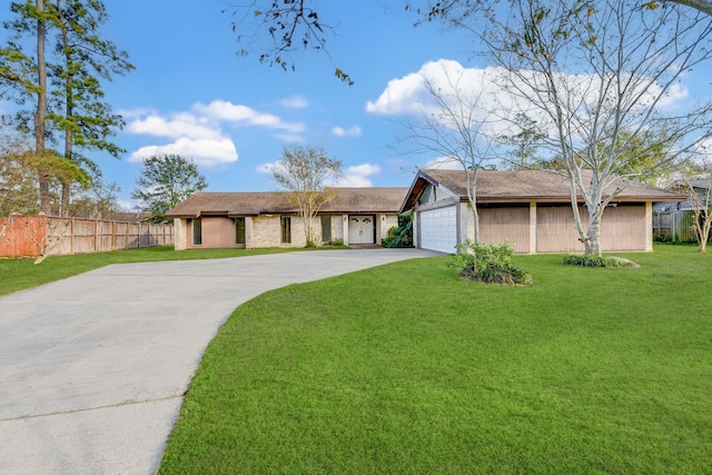 single story home with a front yard and a garage