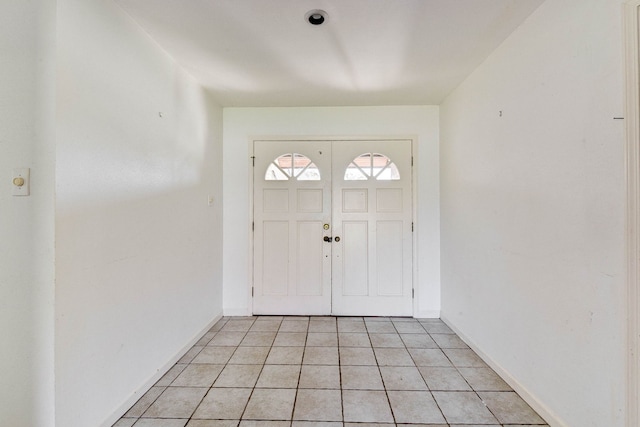 entrance foyer featuring light tile patterned flooring