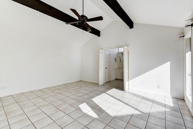 empty room with vaulted ceiling with beams, ceiling fan, and light tile patterned floors