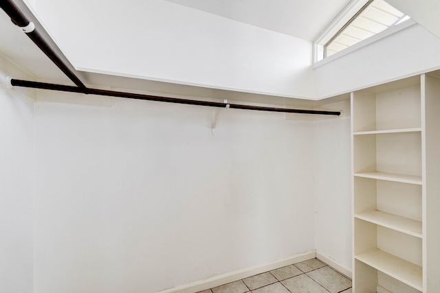 spacious closet with light tile patterned flooring