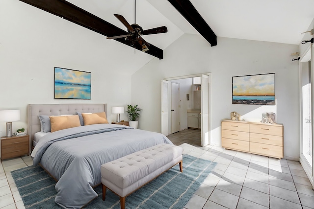 bedroom featuring ensuite bath, ceiling fan, light tile patterned floors, beam ceiling, and high vaulted ceiling