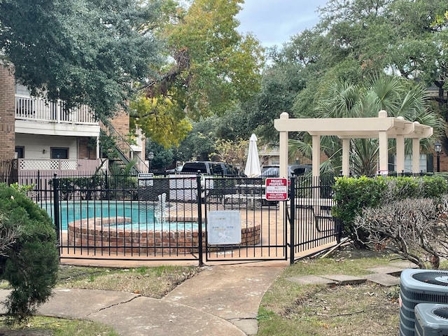 view of swimming pool featuring central AC unit