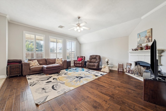 living room with dark hardwood / wood-style flooring, vaulted ceiling, ornamental molding, and ceiling fan