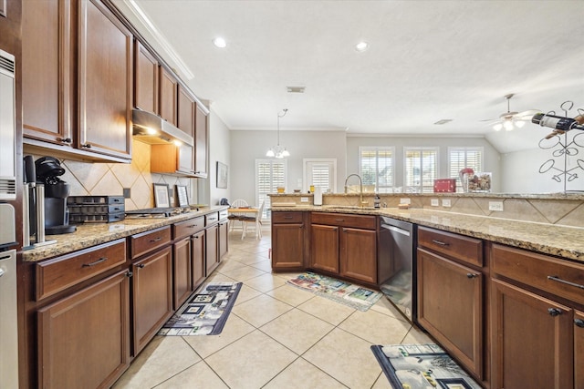 kitchen featuring sink, hanging light fixtures, light stone counters, stainless steel appliances, and crown molding