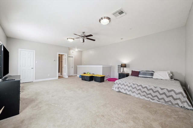 bedroom featuring light colored carpet and ceiling fan