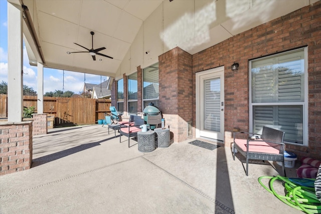 view of patio with area for grilling and ceiling fan