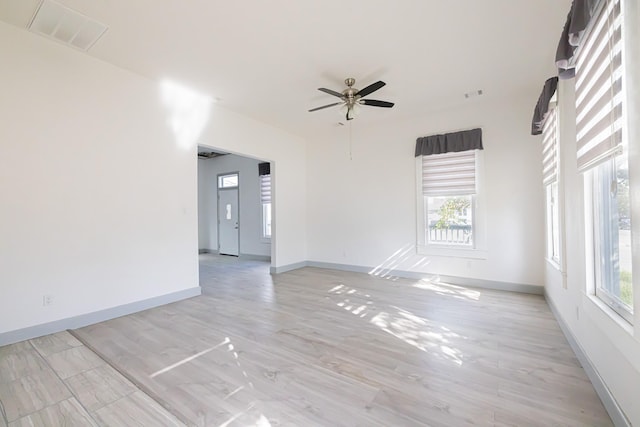 unfurnished room with light hardwood / wood-style floors and ceiling fan