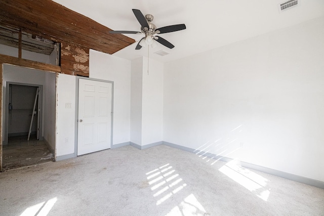 unfurnished bedroom featuring light carpet and ceiling fan