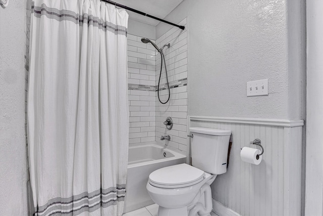 bathroom with toilet and shower / bath combo with shower curtain