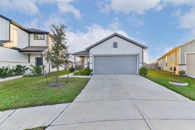 view of front facade with a front yard and a garage