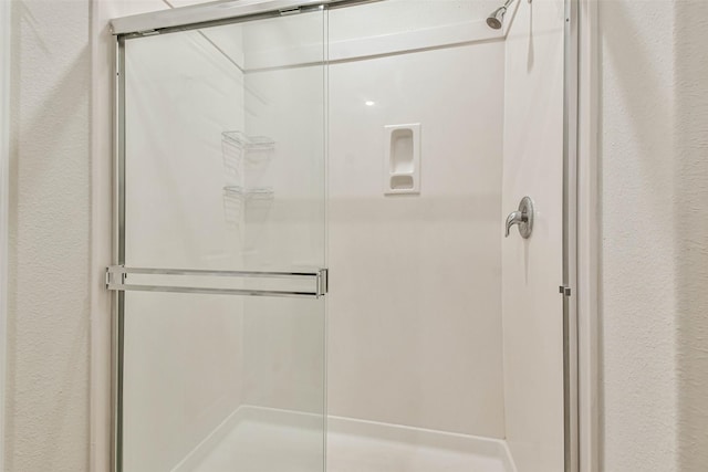 bathroom featuring a stall shower