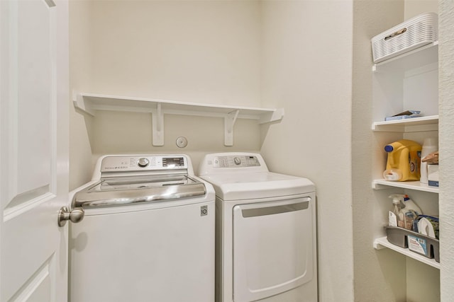 laundry area featuring laundry area and washer and clothes dryer