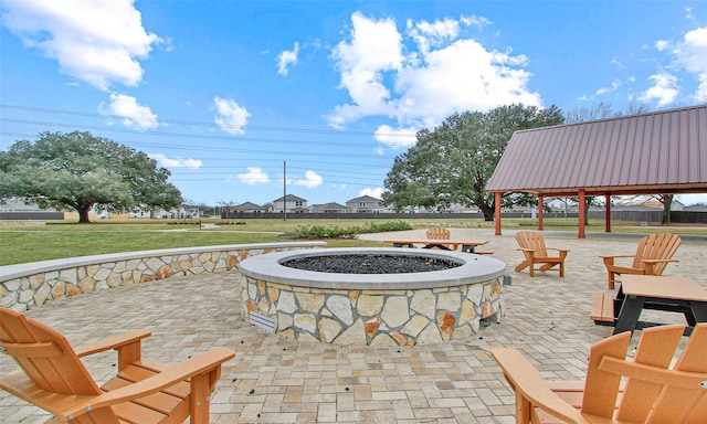 view of patio / terrace featuring an outdoor fire pit and a gazebo