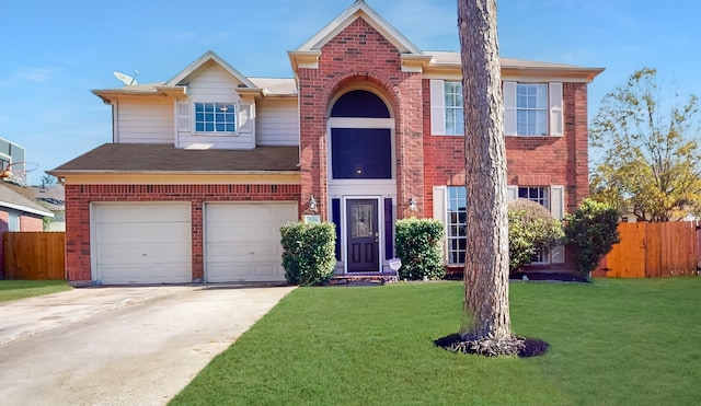 view of front of home featuring a front yard and a garage