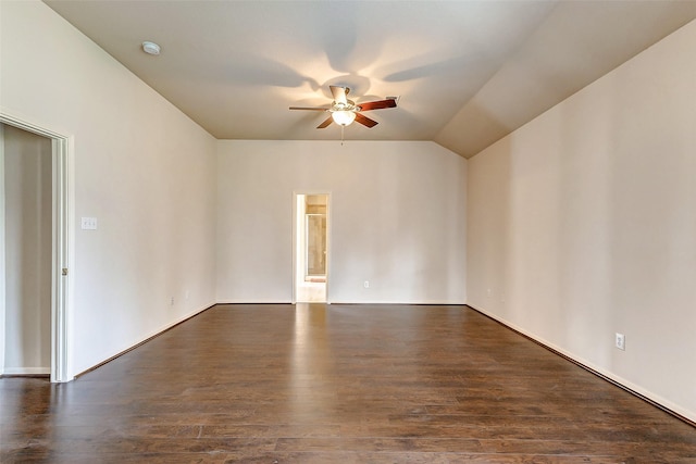 unfurnished room with lofted ceiling, dark wood-style floors, and a ceiling fan